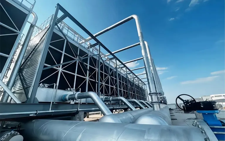 Cooling towers and insulated pipework on a rooftop